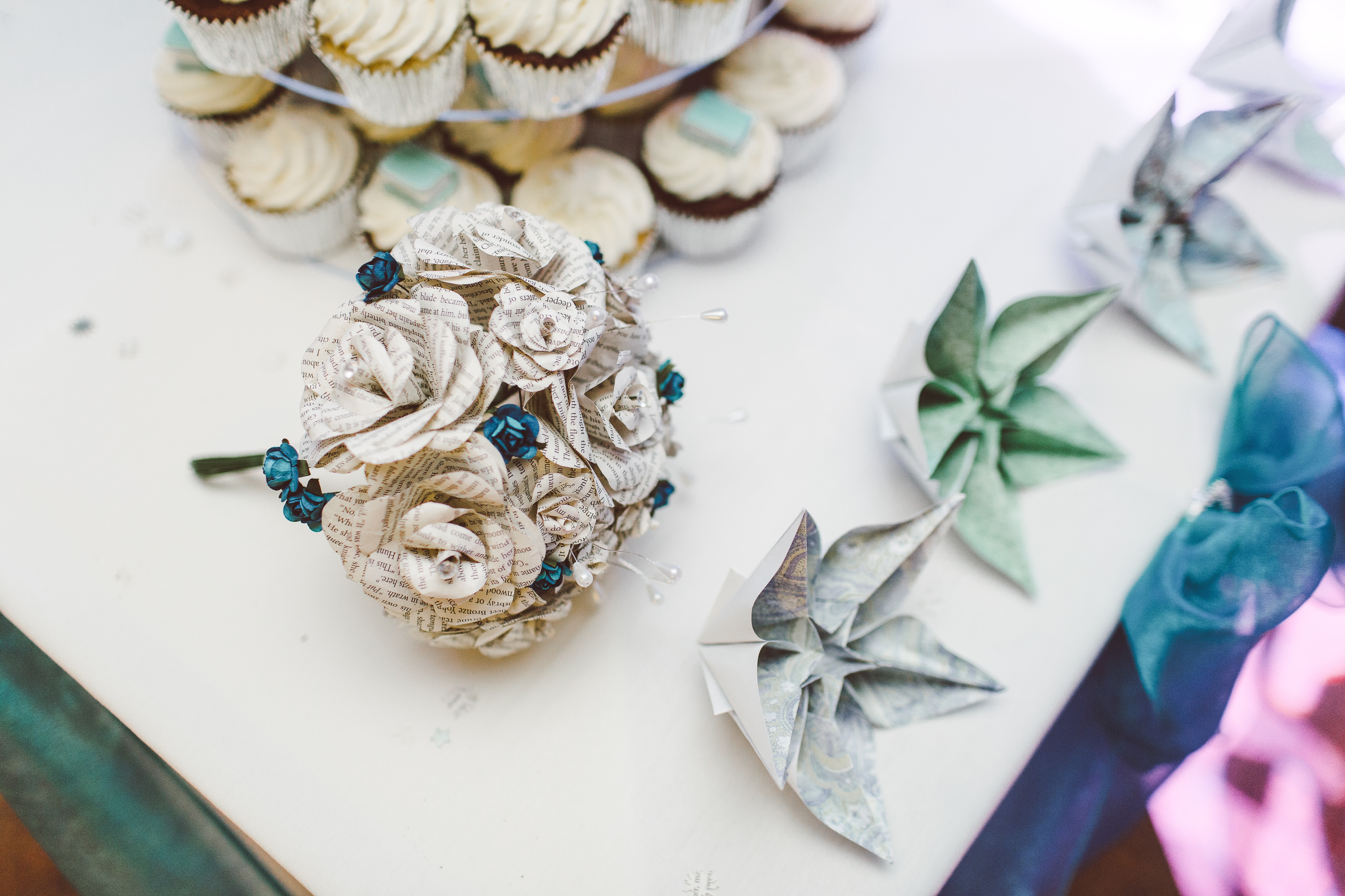 Book paper flowers: photo by Wedding Photography on Unsplash