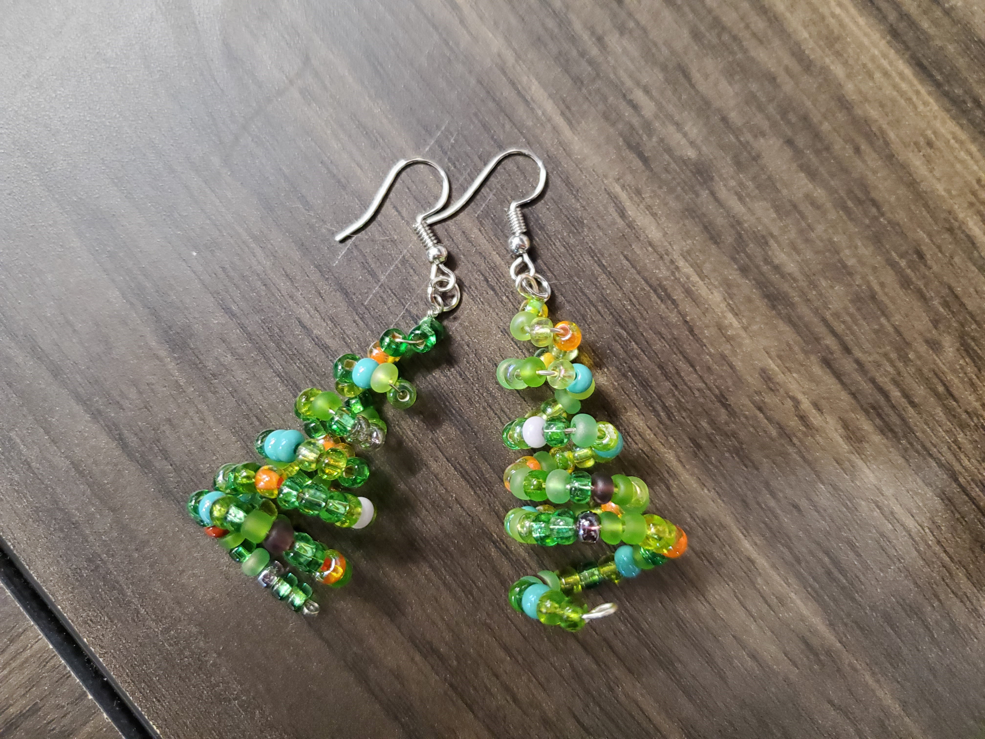 wire and bead earrings in the shape of a tree