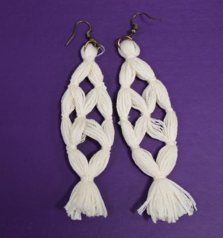 Image of a pair of white tassel earrings