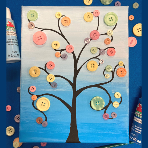 A 8 by 10 canvas painting of a black tree against a blue gradient background. There are pastel buttons glued to the branches.