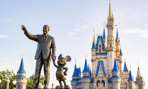 Magic Kingdom castle with Walt & Mickey statue