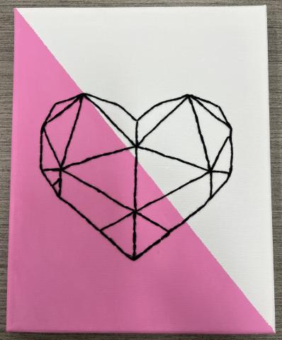 8x10 canvas, diagonal paint: pink on lower left and white on top right. Geometric heart pattern made with embroidery thread in middle of canvas.