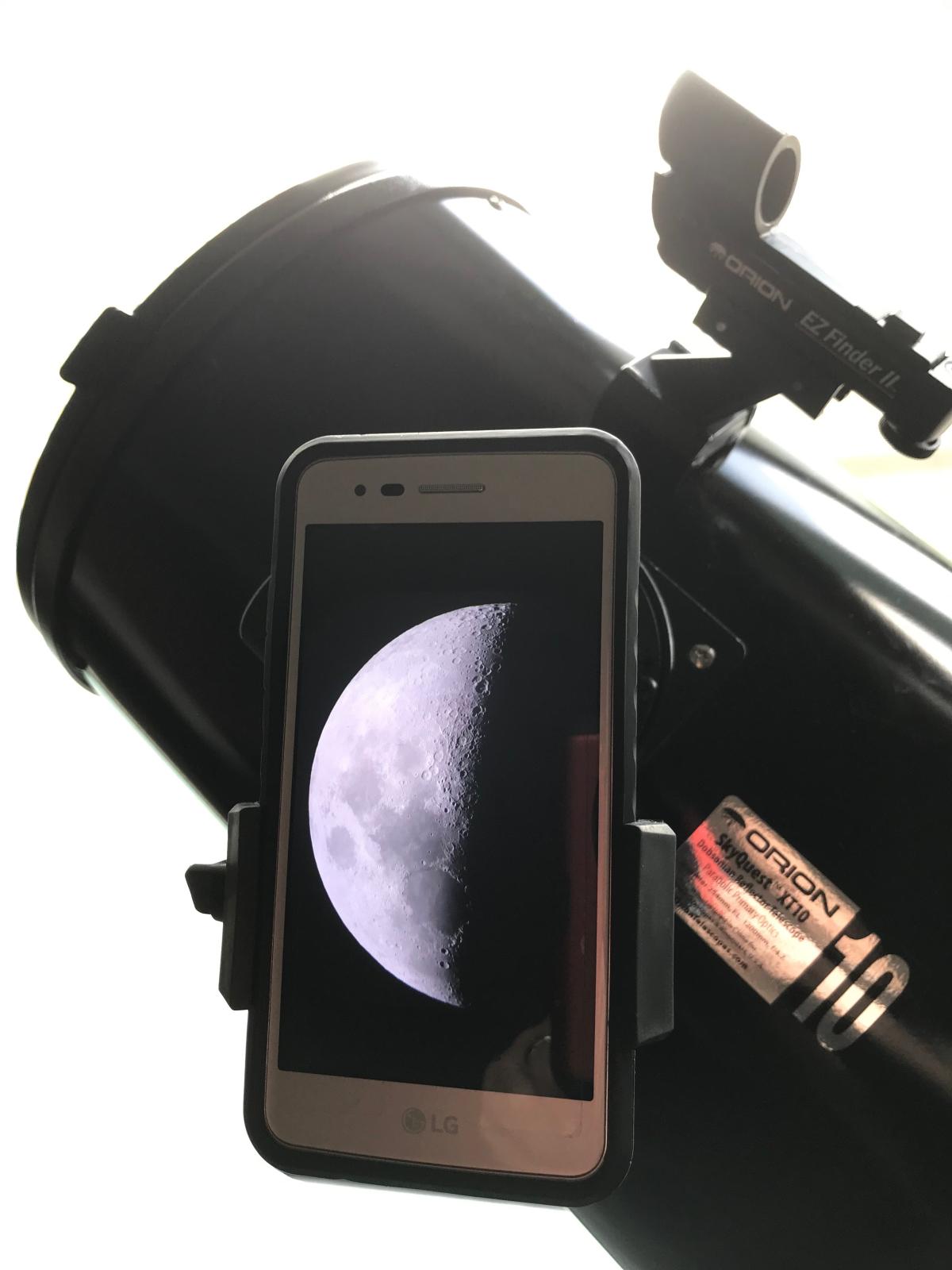 Take photos of the Moon with your own cellphone through our library telescopes.